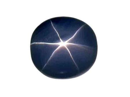 The blue star sapphire huge gem stone - the star, stone of power