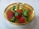 Strawberry on a golden plate