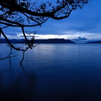 dark blue dusk over the calm lake