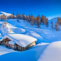 Snowy mountain hut