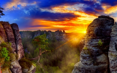 Natural torch - rays, valley, sky, sunshine, sunlight, mountain, colorful, rocks, glow, view, amazing, clouds, beautiful, torch, natural, cliffs