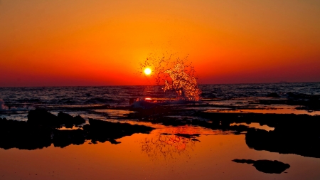 ocean splash on a beach at sunset - sunset, beach, sea, splash, orange, rocks