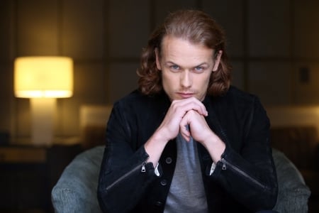 Sam Heughan - black, sam heughan, yellow, hand, actor, male, man