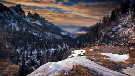 winding road down a valley in winter - winding, forest, mountains, winter, road, clouds, valley