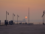 beautiful setting sun behind the ship