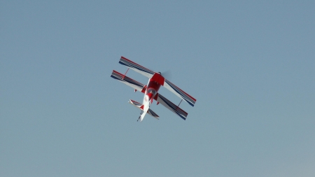 RC biplane climbs and turns