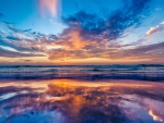 beautiful colored sunset reflected on beach