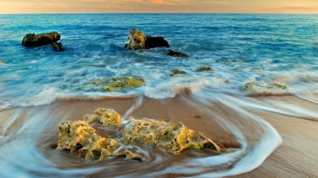 receding wave on a stone covered beach hdr - foam, beach, hdr, waves, sea, rocks