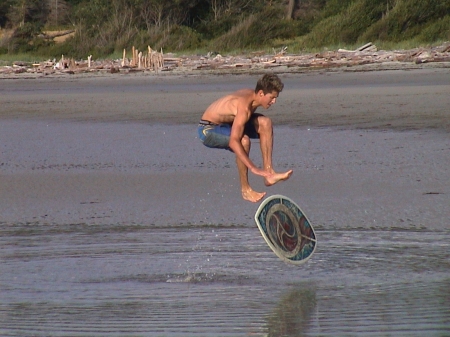 Mikey is a Master on the skimboard - summer fun, beach, skimboarding, hornby island