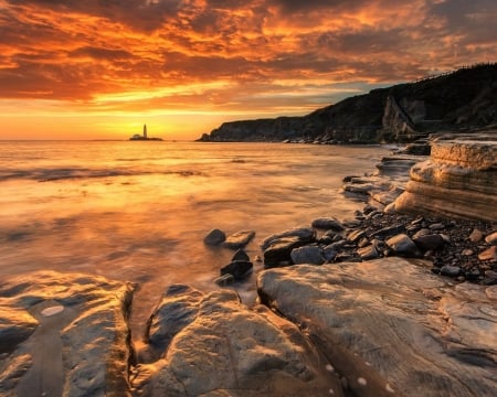 Lighthouse at Sunset - nature, lighthouse, landscape, clouds, sunset, sea, rocks