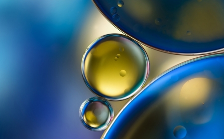 Oil bubbles in water - oil, glass, yellow, luminos, blue, water, bubbles, texture