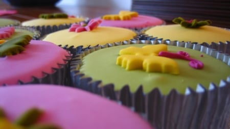 Up close & delicious - cupcake, yellow, butterflies, spring, pink, tasty, sweet, flowers, rainbow, green, foil cup, fondant, pipe