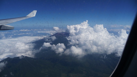 vulcano - airplane, landing, wing, blue, air, beach, vulcan, bali airport, vulcano, sky, clouds, airplane window, water, beautiful, photography, sea, travel, bali, wings, airplanewing, wallpaper