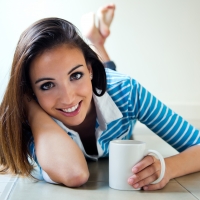 Beautiful brunette girl drinking coffee