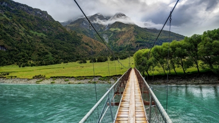 bridge over turquoise rver - clouds, river, grass, turquoise, mountains, bridge