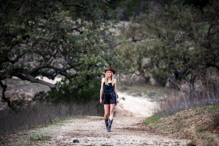 ~Cowgirl~ - branches, hill, hat, trees, cowgirl, dirt, boots, road, dirt road, weeds, dress, blonde