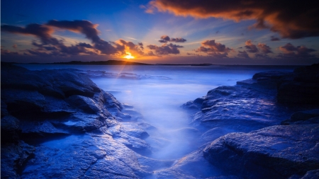 Majestic Nature - clouds, blue, rock, sea, sunrise, ocean, white, sunset, nature, bluewater, weather, sky