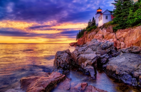 Lighthouse at sunset - lighthouse, sky, ocean, colorful, shore, sunset, rocks, waves, amazing, beautiful, sea