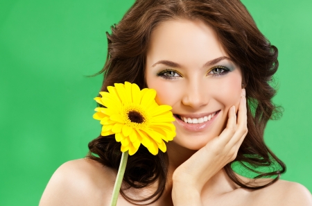 Beauty - yellow, girl, beauty, flower, hand, green, woman, model, face, gerbera