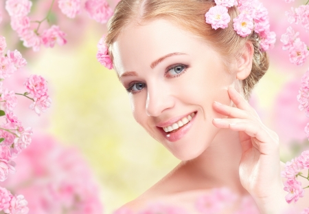 Beauty - beauty, woman, girl, spring, model, face, sakura, yellow, pink, hand, blossom, smile, flower