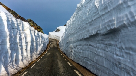 road through a tunnel of snow and ice - road, walls, ice, blacktop, snow