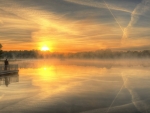 sunrise over a misty lake hdr