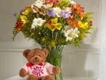 spring bouquet and teddy bear