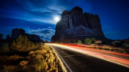 lights in slow exposure on a desert highway