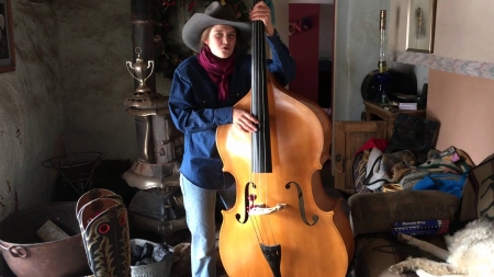 Cowgirl On A Bass.. - girls, women, style, fun, models, hat, female, cowgirl, music, fashion, boots, hats, bass, brunettes, western, ranch