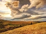 beautiful clouds over rolling hills hdr