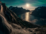 waterfall above a majestic fjord in greenland