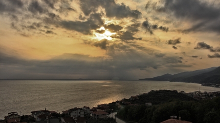 sunset rays over seaside town - clouds, sunset, town, coast, rays, sea