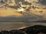 sunset rays over seaside town