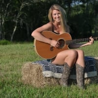 Cowgirl Playing the Guitar