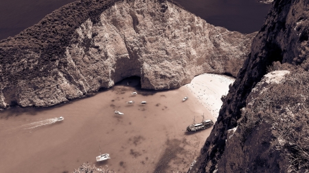 cove beach on the isle of zakynthos greece - beach, cove, boats, cliff, island, sea, rocks