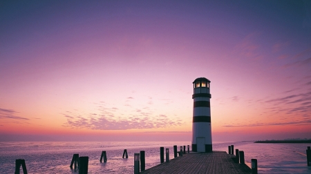 lighthouse at the end of a pier - purple, lighthouse, pier, sunset, sea