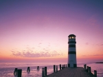 lighthouse at the end of a pier