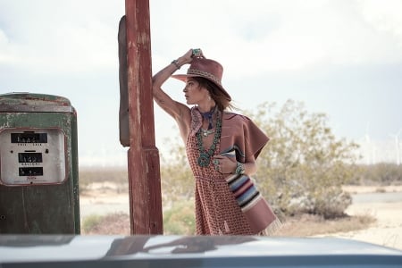 Thinking Of What She Left Behind.. - style, gas pumps, girls, western, women, models, hats, outdoors, brunettes, cowgirl, fun, female, fashion