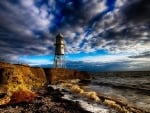 little metal lighthouse on england coast hdr