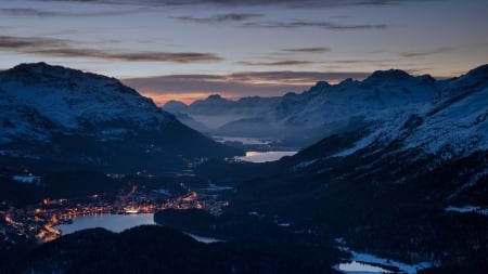 panorama of towns and lakes in a swiss alpine valley - lakes, mountains, dusk, lights, valley, towns