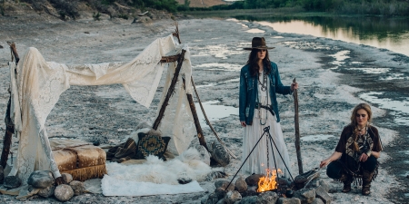 Cowgirl's Campsite - hat, water, boots, wood, pillows, fashion, brunettes, sitcks, campfire, cowgirls, campsite, blankets, fire, flames, rocks