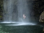 couple behind a waterfall