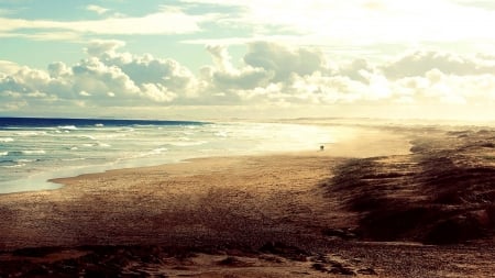 couple walking on a vast beach - clouds, vast, beach, waves, sea, couple