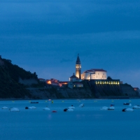 church in a seaside slovenian town in evening