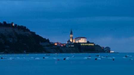 church in a seaside slovenian town in evening - town, coast, lights, evening, sea, church