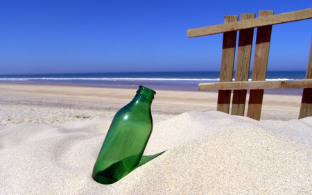 Bottle in beach - ocean, beach, board, fence, hedge, beach sand, water, blue sky, green, bottle, sea, sand