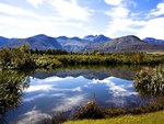 BLUE SKY REFLECTION IN LAKE