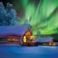 log cabins in winter under aurora borealis hdr