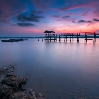 ocean sunset over a pier