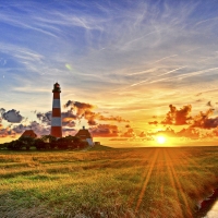 Lighthouse under Bright Sunlit Sky